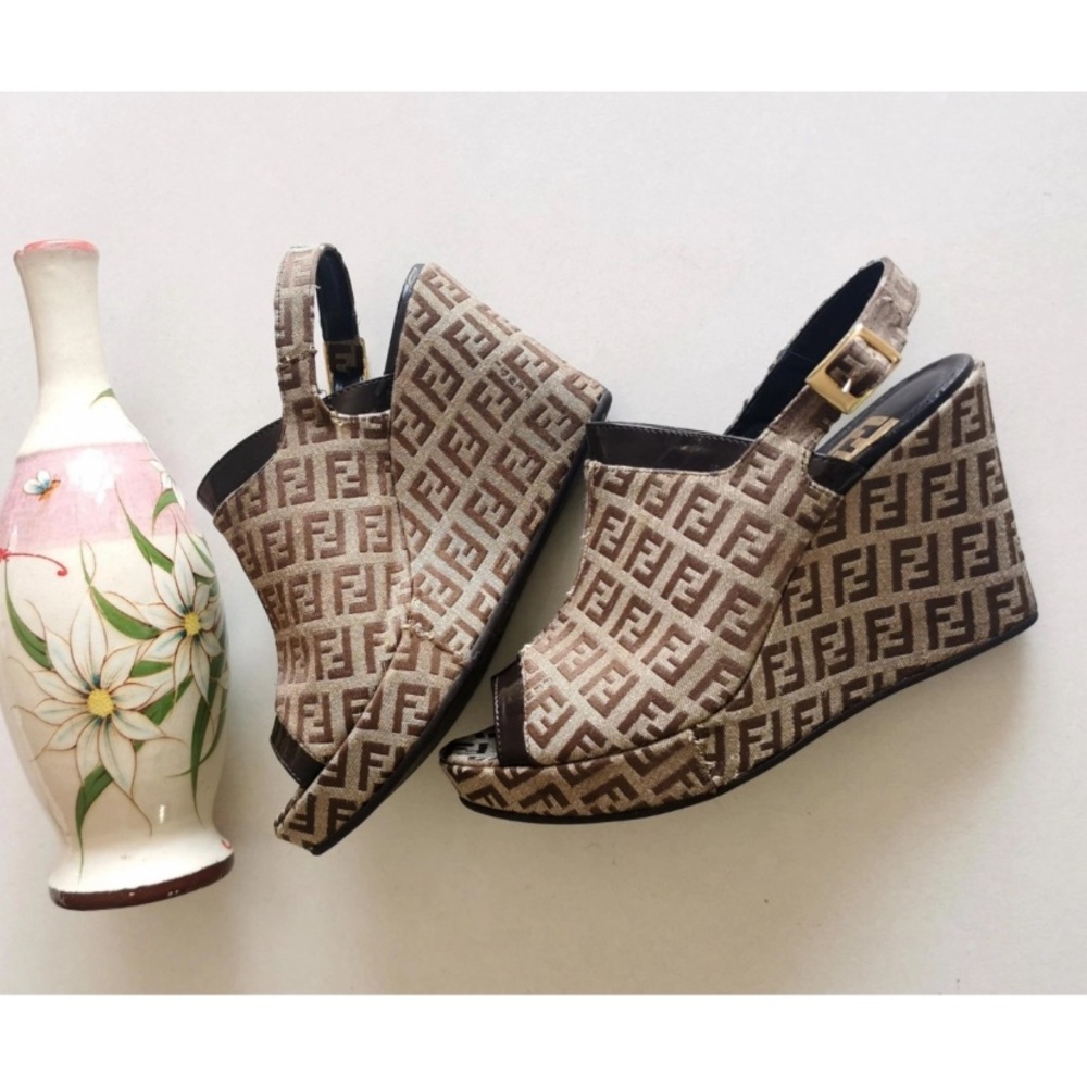 Authentic Fendi wedge sandals size 38IT.  8CM heel.  shoe fits more like a 37.5